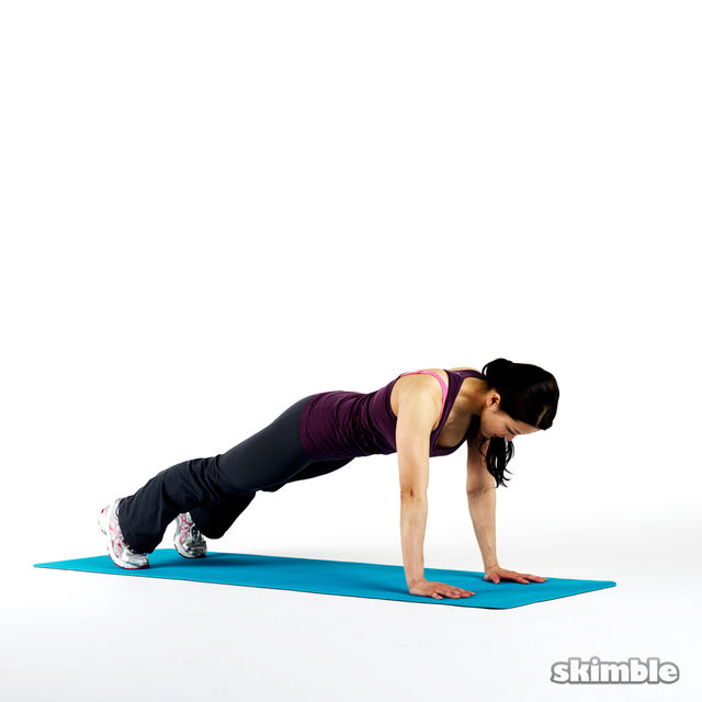 Start in a full plank position.