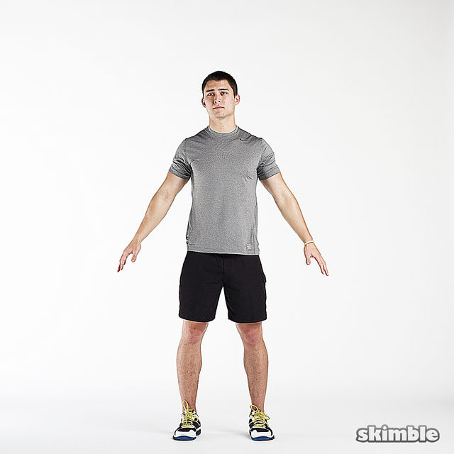 Stand with feet hip-width apart and arms raised to your sides.